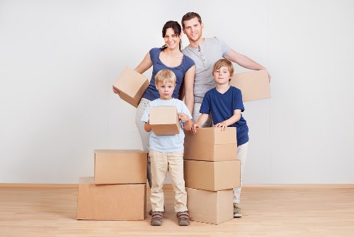 Packed office equipment prepared for relocation in Hammersmith
