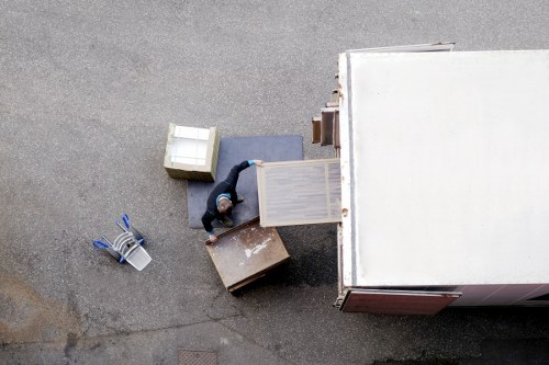 Customer moving boxes carefully inside a storage corridor