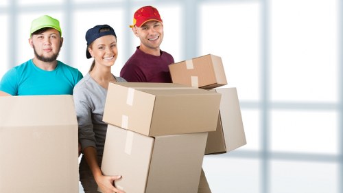 Boxes and furniture being loaded for a local flat removal
