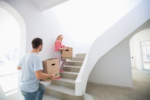 A resident arranging belongings in a Hammersmith storage unit